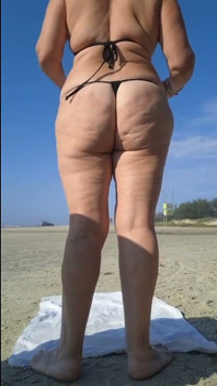 Hot Crown Sunbathing on the Beach in Transparent Micro Bikini
