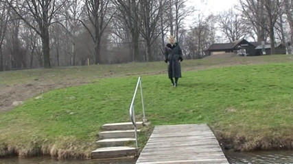 Femdom Austria: Bitch in leather pissing on a pier