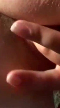Horny brunette with big boobs masturbating outdoor