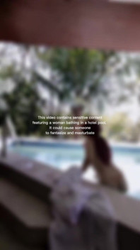 Woman Hijab Bathing Naked in an Open-air Hotel Pool