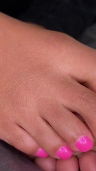 Ebony Girl Gives Her Feet a Massage with a Massage Gun