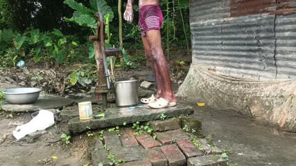 Ranjit Roy: Black mature man bath in desi style. Showing big dick.