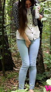 Desperate Brunette in a Forest Holding Her Crotch to Stop Herself From Pissing in Her Jeans