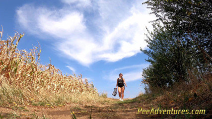 Pee Adventures: Chubby brunette pee on a dirt road in the middle...