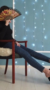 Worshiping the feet of a girl in blue jeans