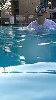Couple Underwater Diving and Swimming