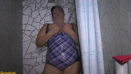 Anna Devot: In swimsuit under the shower