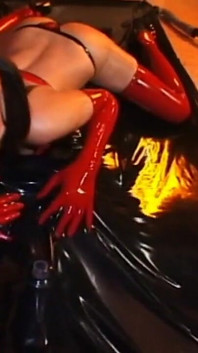 Latex masked guy and babe humiliating