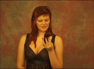 Gazongas: On her phone and showing boobs