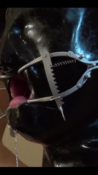 Two Fully Rubberized Rubber Dolls on Latex Sheets with Gas Mask and Liquid Container