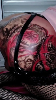 Huge Red Dildo Destroying the Ass of the Tattooed Shemale