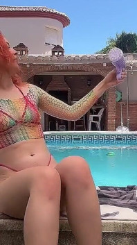 Having Fun with Bubble Maker Nearby Pool