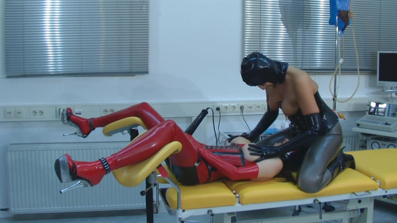 Rubber & Clinic Studio - 1ATOYS: Lesbian rubbergirls playing on the gynchair