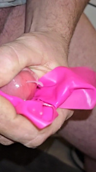 A Slow Motion Closeup Video of Me Shooting Some Thick Loads of Cum, While Jerking with a Sheet of Pink Latex