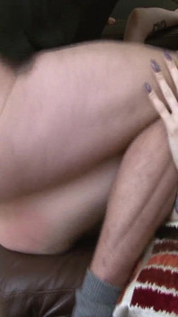 Tattooed Brunette Gets Fingered on the Couch and Cums Hard