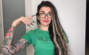 Finger Snapping and Sucking Fingers with Green Long Nails Long Hair Glasses and Face