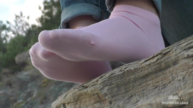 Mistress Legs: Sexy feet in pink ankle socks on the seashore