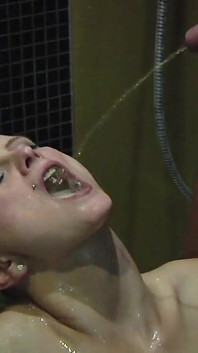 Big Tittied Blonde Tattooed Pierced Babe Pisses and Gets Pissed on by Two Men