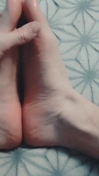 Guy Gently Massages His Feet with Oil