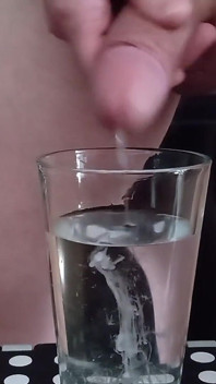 Cumming in a glass of hot water 