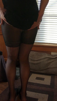 A Trans Lady in a Sparkly Dress and Pantyhose Shows Her Bum in Her Fitting Room
