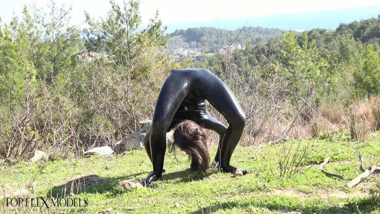 Flexilady: Flexible in a Black Catsuit