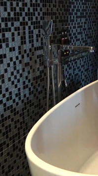 Chubby Stepdaddy Pissing in Bathtub