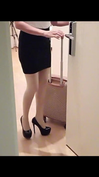 MILF in Stockings and Heels Walks Through the Corridors of a Hotel