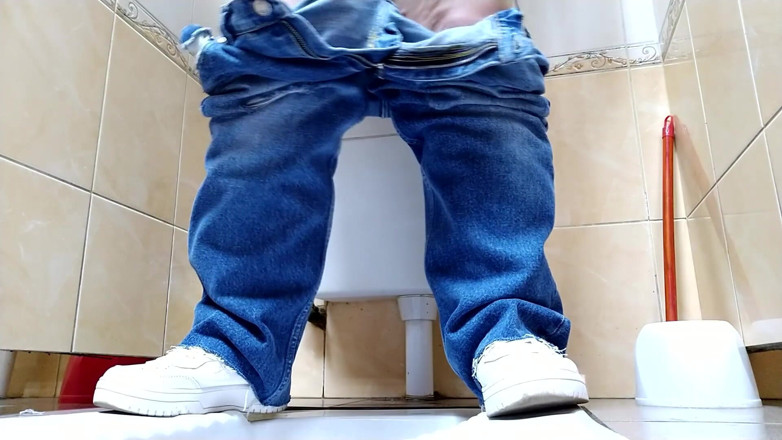 Elena: Hot MILF in jeans pissing in a public restroom