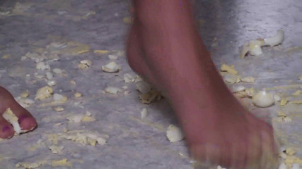 Foot Girls: Brunette crushing food in the kitchen