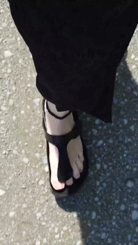Outdoor in a Black Caftan and Barefoot in Black Birkenstocks