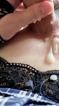 A Boy in Fishnet Stockings with Garters and a Skirt Cums on His Tummy
