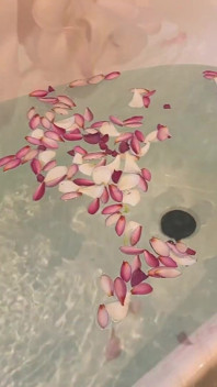 Bath of Blossoms Naked MILF Masturbates Among Flowers