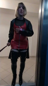 Public Walk in Parking House, Blonde in Overknee Boots, Red Pvc Dress and Long Leather Coat.