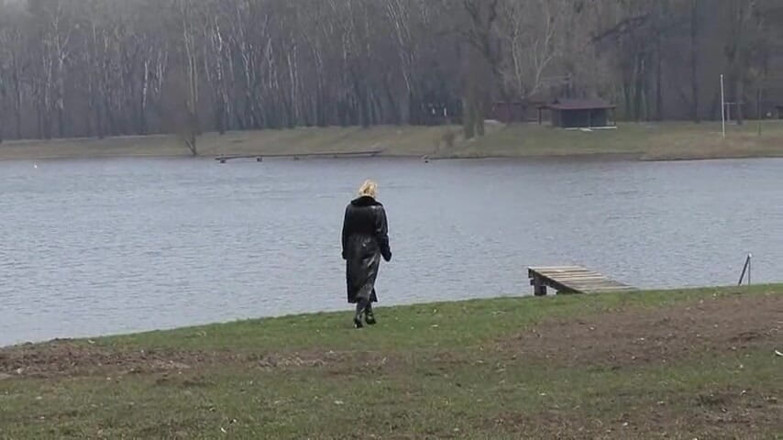 Femdom Austria: Bitch in leather pissing on a pier