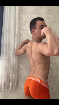 Cute Athlet Boy Showing Muscle