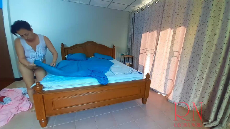 Regina Noir: Nudist housekeeper Regina Noir makes the bedding in the bedroom....