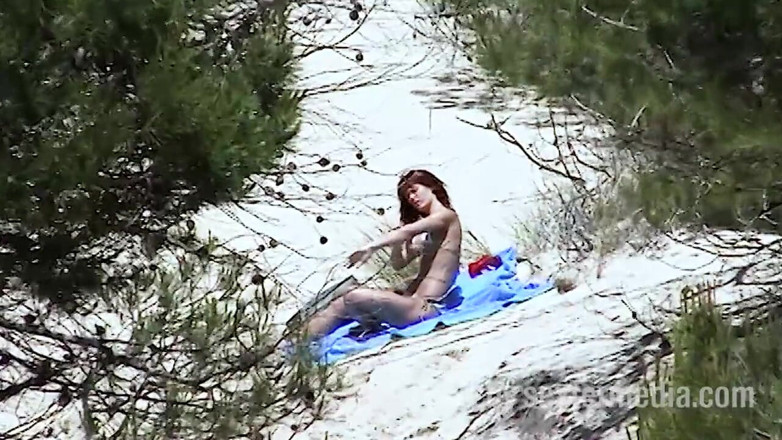 Sextermedia by Pete: Redhead beauty dildoing pussy on the sandy beach