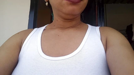 On the Balcony of Her House