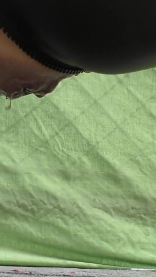 Thumbnail of Pee in spandex siut on balcony above bar