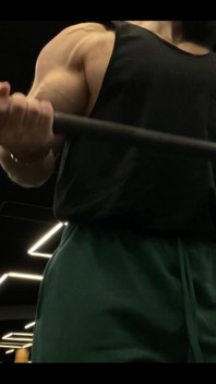 Doing a Biceps Curls with a Straight Barbell