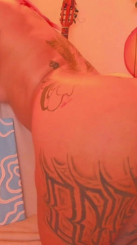 A Latina with a Tattooed Body Is Shaking Her Butt for You
