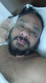 Indian Daddy Lying on the Bed Teasing and Posing for You