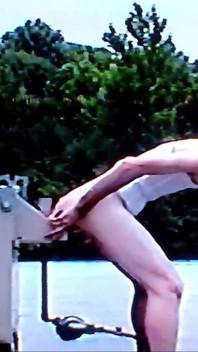 Crossdresser Riding a Giant Dildo on a Roof Top