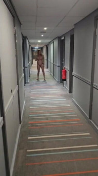 Naked in the Village Hotel Corridor