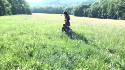 Femdom Austria: Pet on the leash in a meadow