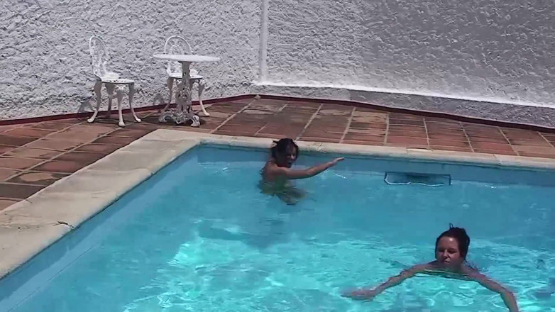 Lesbian Stories: Two gorgeous babes are masturbating by the pool