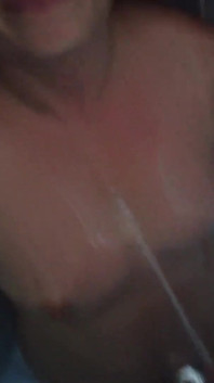 Pregnant Brunette Gets Pissed on Her Oiled Tits
