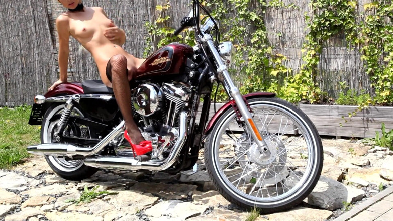Public Entertainment: Skinny babe on the bike