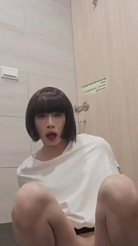 Shemale Ting Xuan Masturbating with a Dildo in a Public Toilet